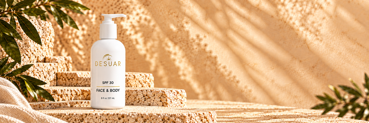 DE SUAR SPF 30 face and body lotion on sunlit textured travertine