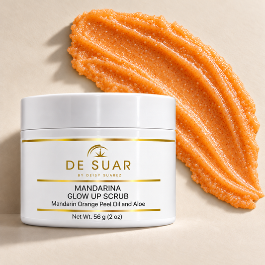 Mandarina Glow Up Scrub — 2 oz jar beside orange exfoliating scrub texture